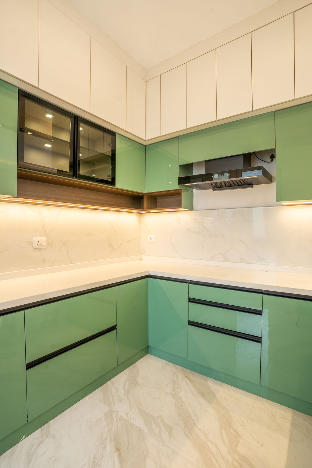 Pista-green and white modular L-shaped kitchen