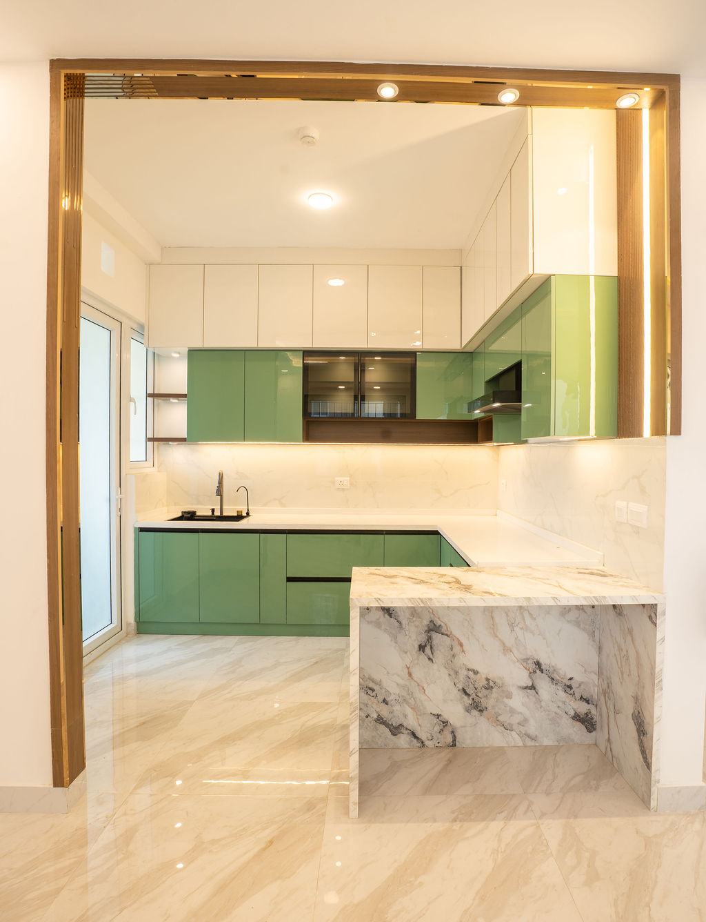 Marble breakfast counter in a green kitchen