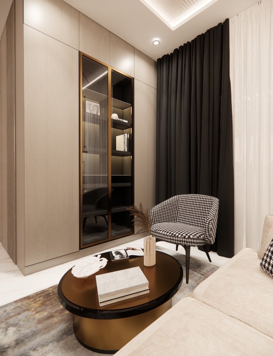 Brass-framed glass display cabinet beside a houndstooth chair