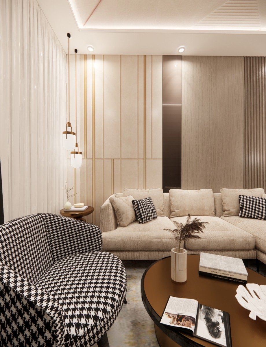 Houndstooth accent chair and bronze drum table in the lounge