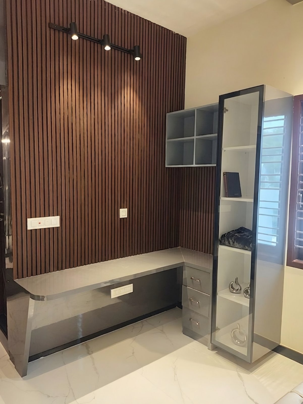 Fluted wood TV wall with floating console and tall glass display cabinet