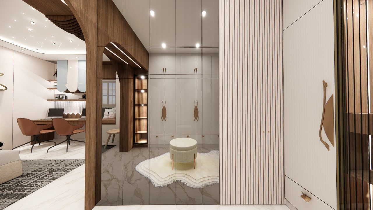 Walk-in dressing area with arched opening and study beyond